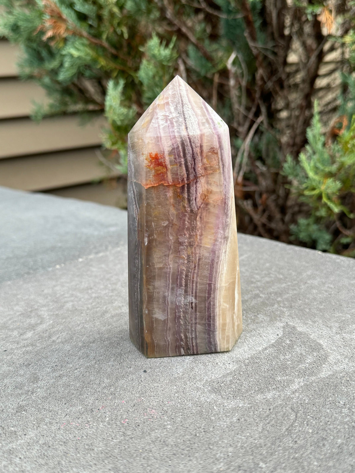 banded fluorite crystal tower with graden inclusions and feathering, fluorite crystal tower