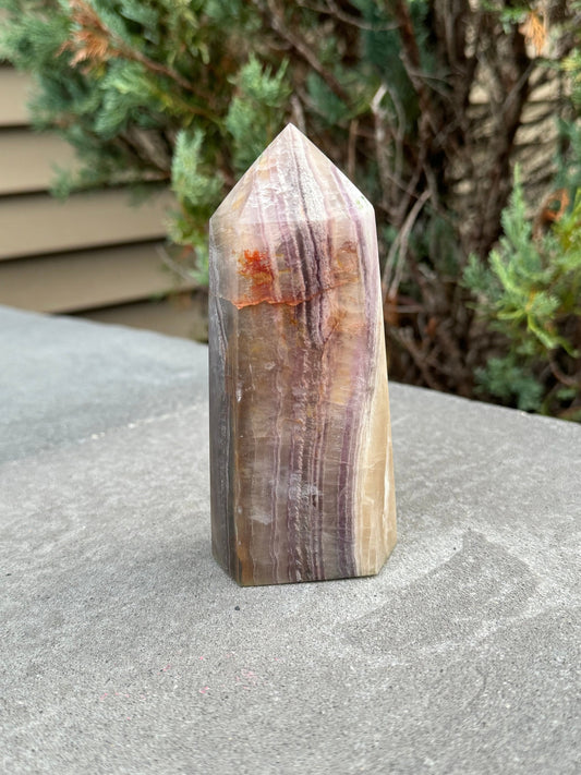 banded fluorite crystal tower with graden inclusions and feathering, fluorite crystal tower