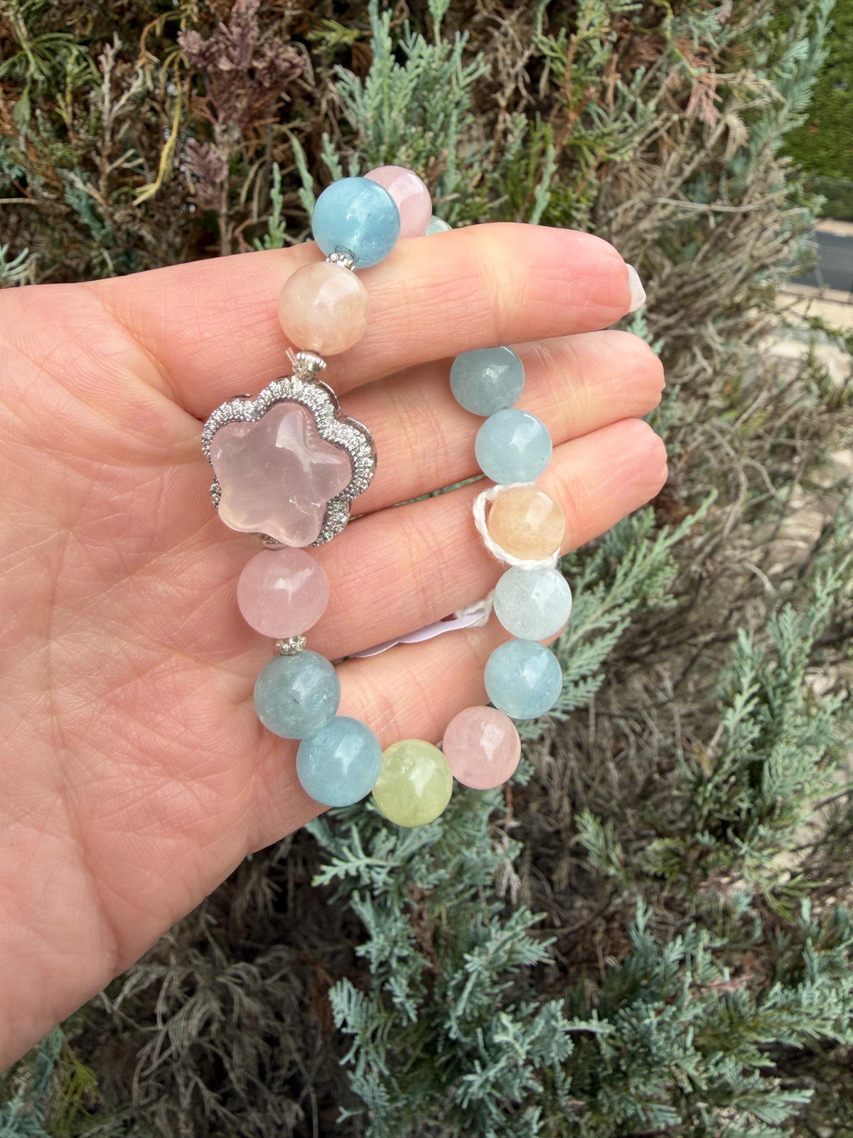 Mixed Beryl beaded bracelet with pastel aquamarine, morganite, heliodor beads and a carved rose quartz flower charm.