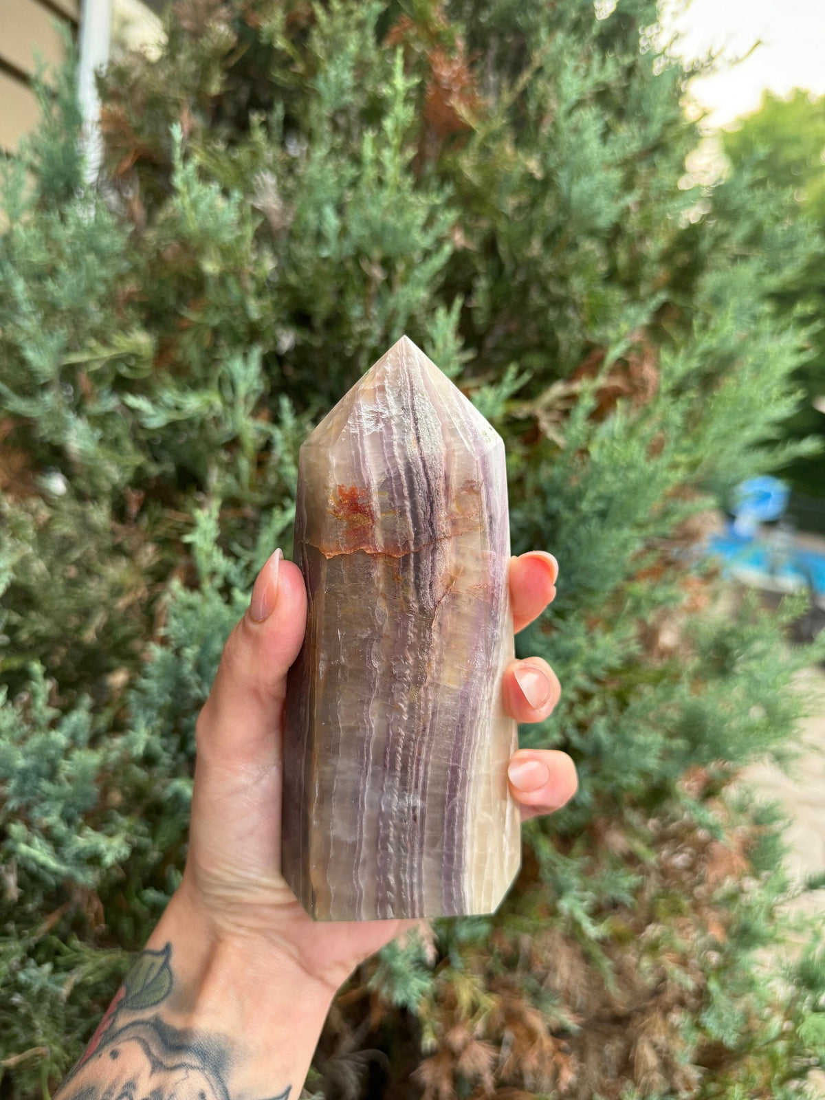 banded fluorite crystal tower with graden inclusions and feathering, fluorite crystal tower
