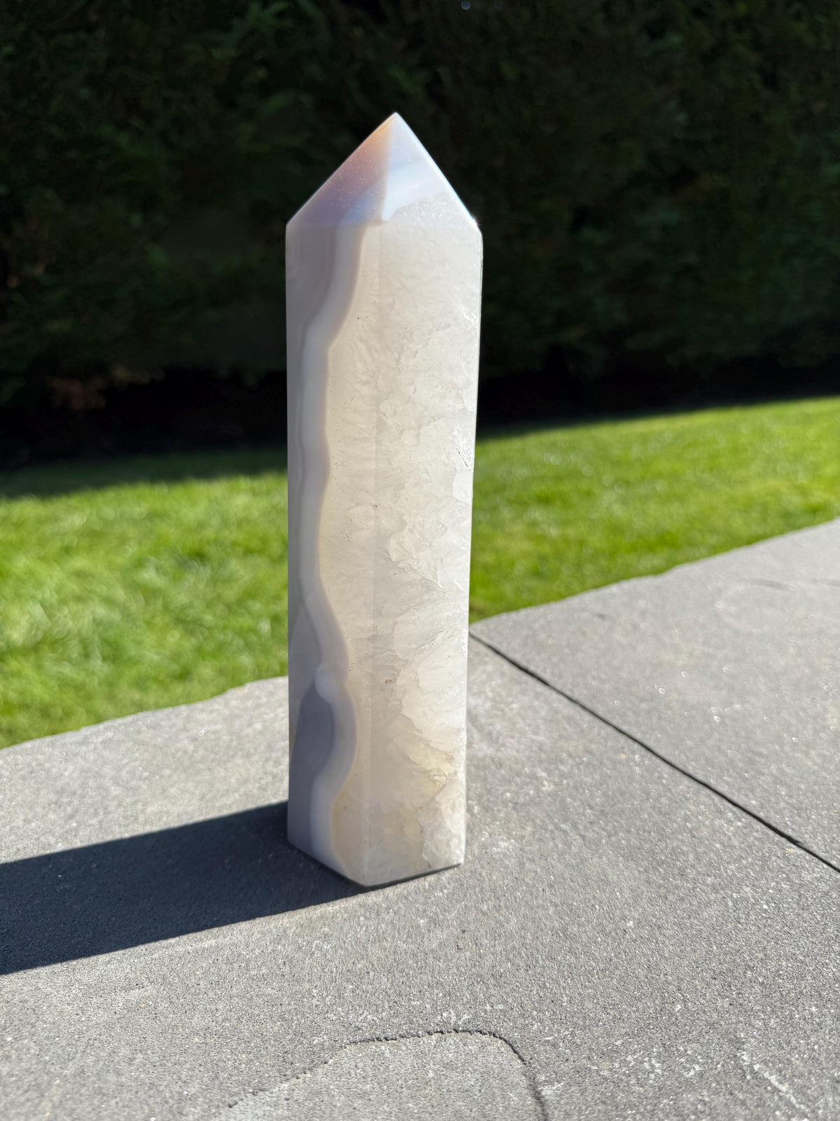 Side view of XL Blue Banded Agate Quartz Tower showing polished point and natural banding patterns.