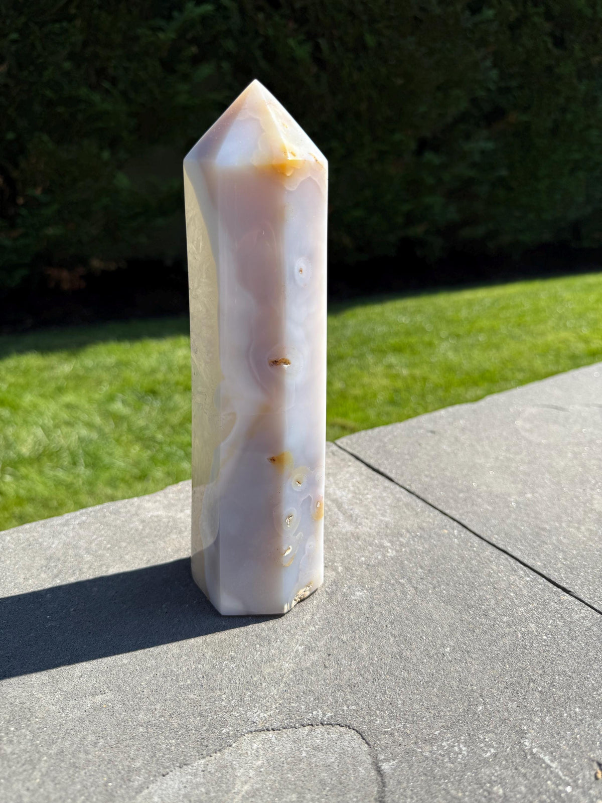 Close-up of Blue Banded Agate Quartz Tower highlighting natural blue and white agate layers and smooth polish.