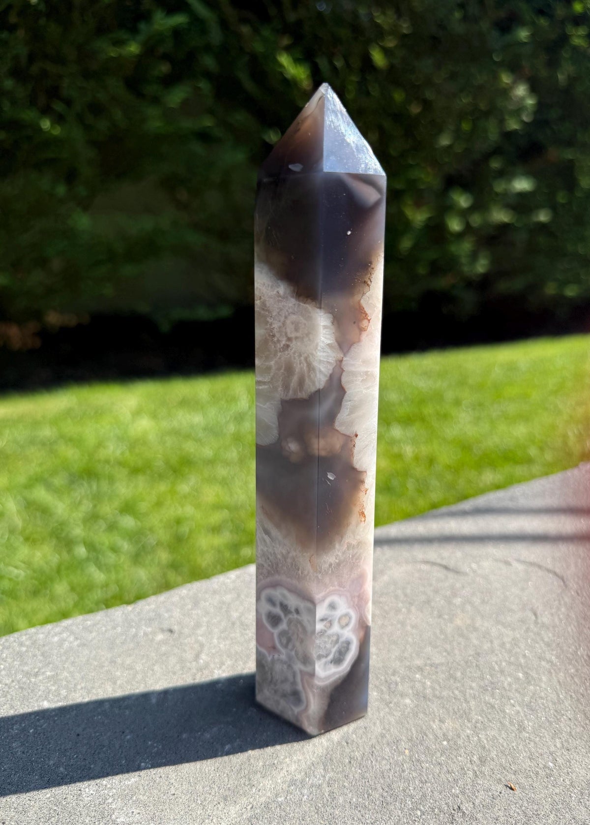 Side view of Black Flower Agate Druzy Tower showing floral patterns and glittering crystal tips.
