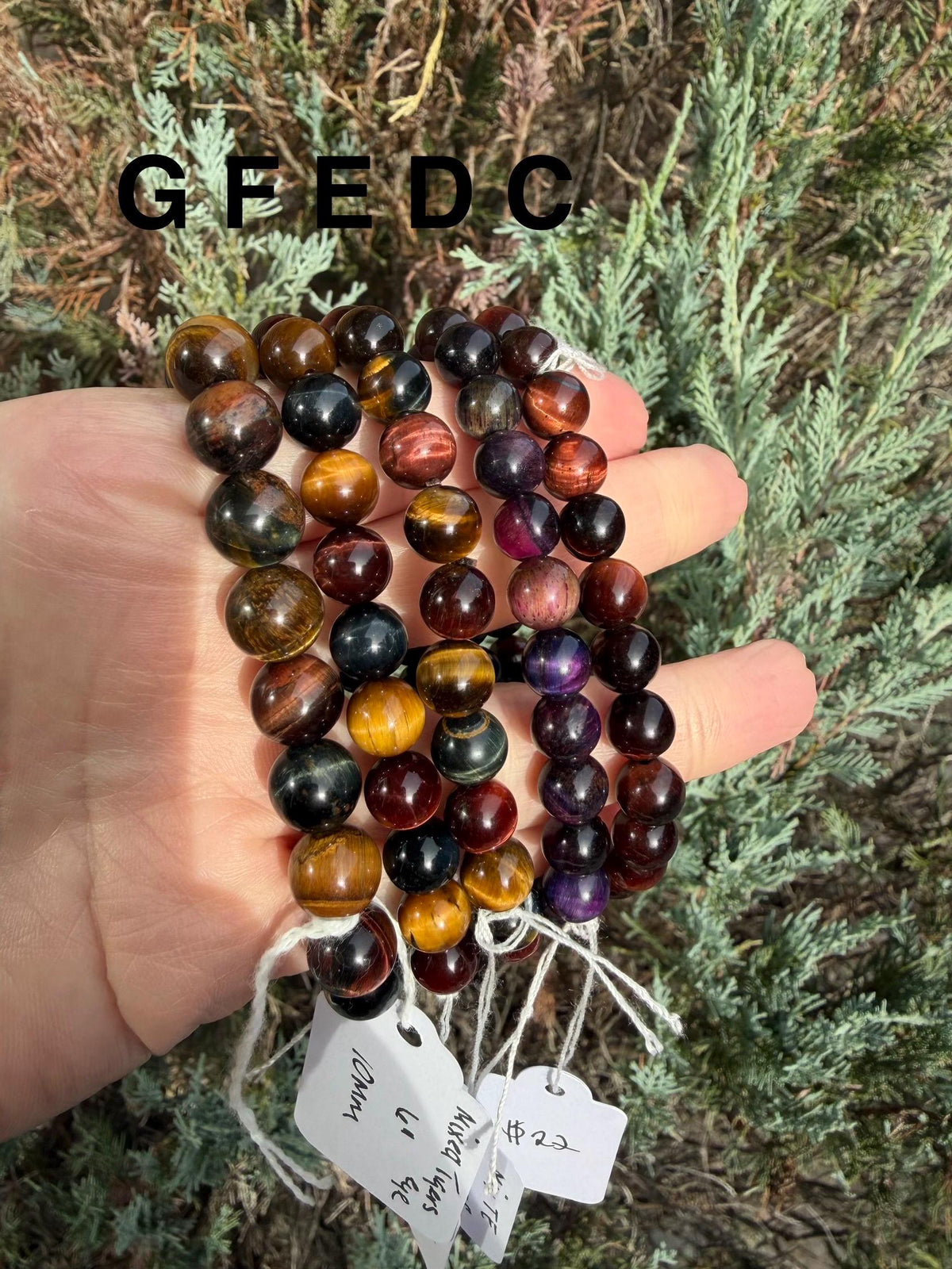 Tiger’s Eye bracelets in different bead sizes arranged together.