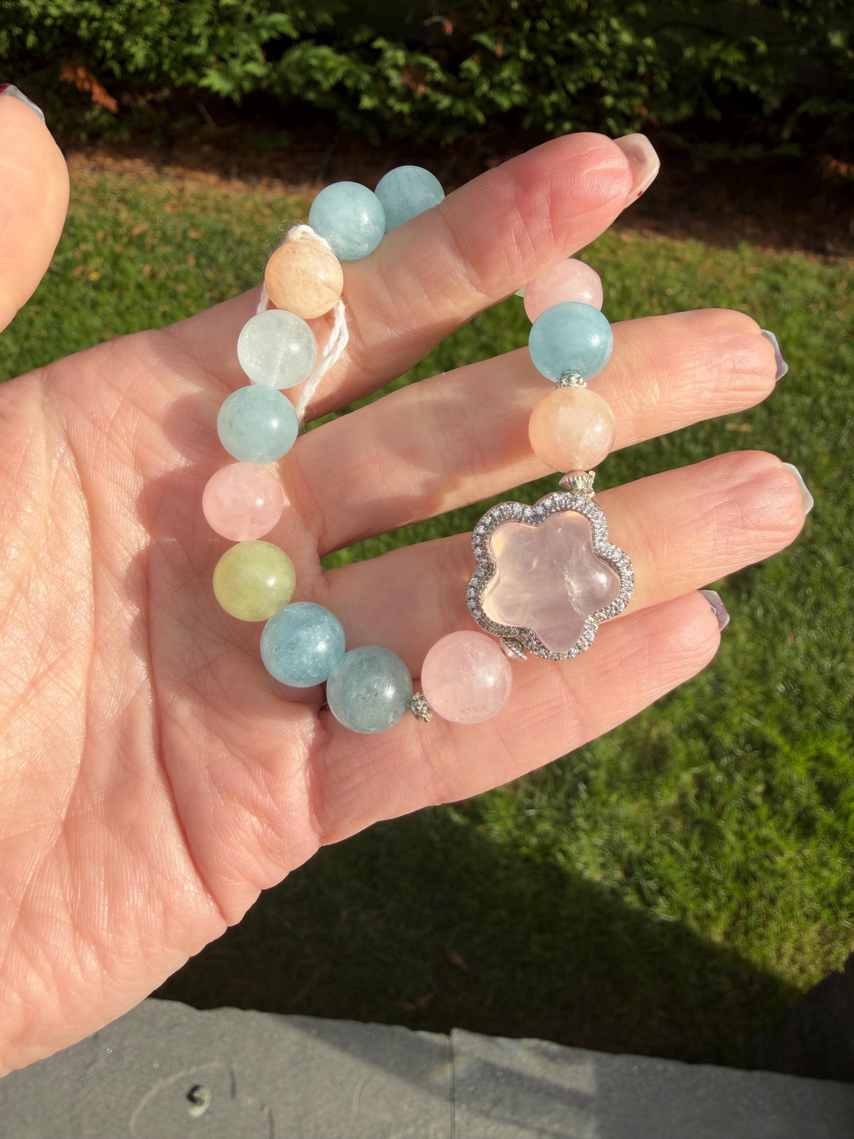 Rose quartz flower charm attached to mixed beryl pastel gemstone beads.