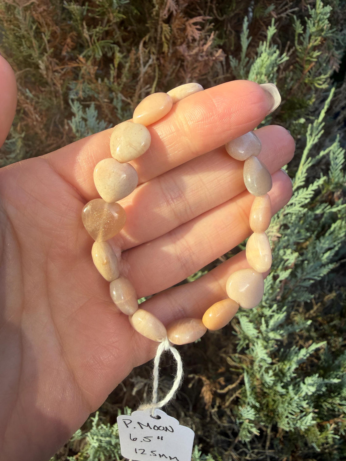 Peach Moonstone heart bracelet with polished peach moonstone heart shaped gemstone beads.