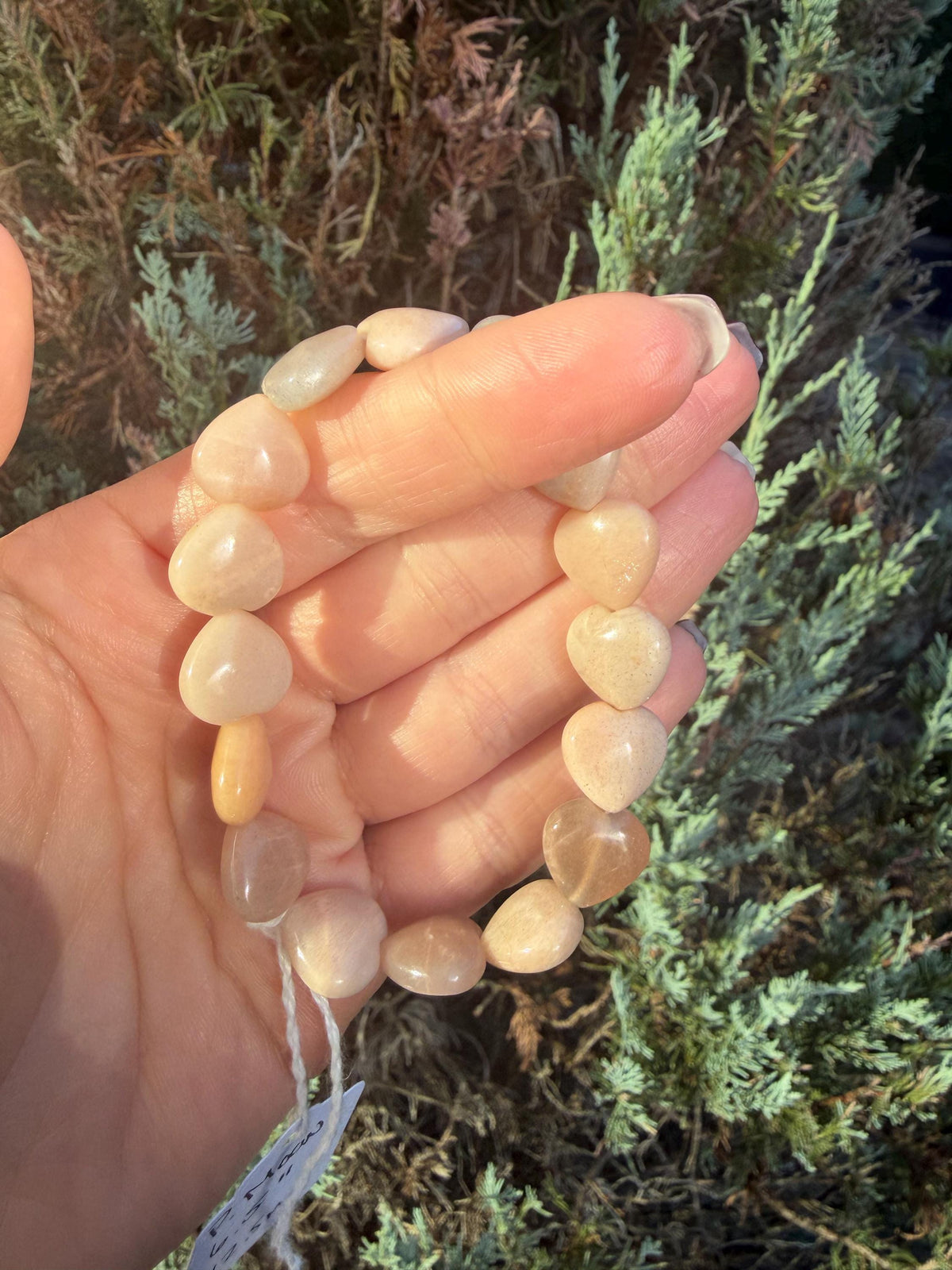 Peach Moonstone heart bracelet with polished peach moonstone heart shaped gemstone beads.