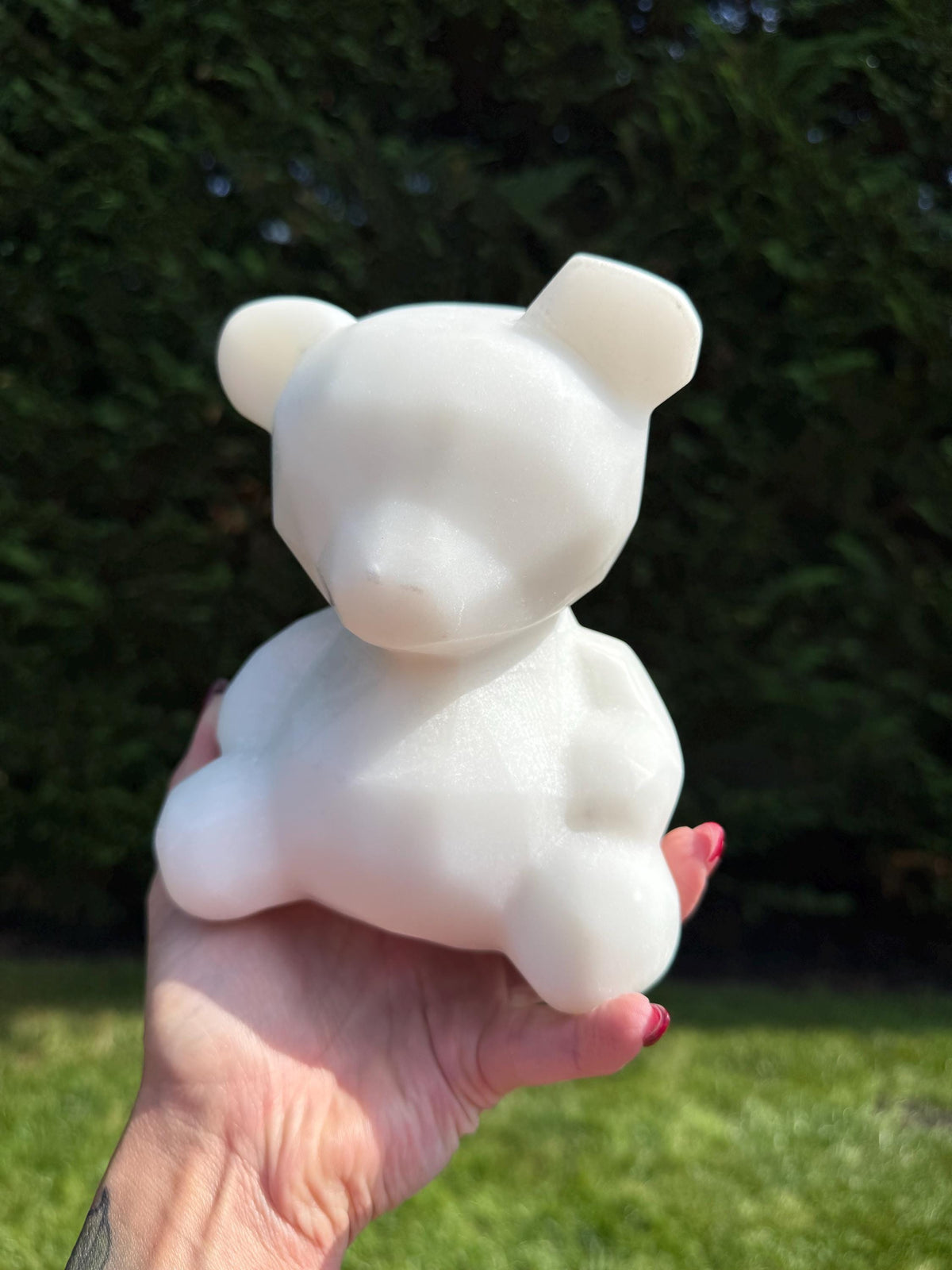 XL white jade bear carving displayed on tabletop with soft lighting highlighting the translucent stone.