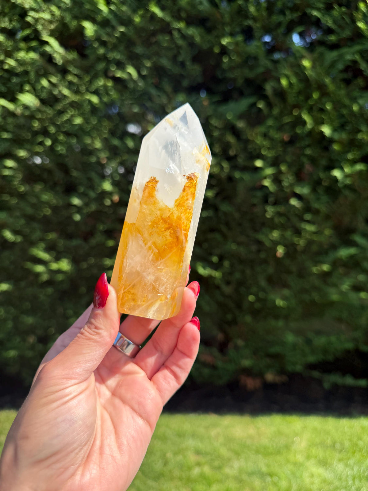 Girasol and Golden Healer Crystal Tower with polished obelisk surface and golden streaks.